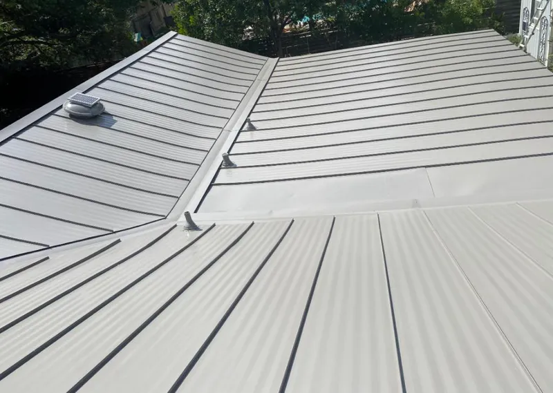 Solar attic fan installed on a metal roof for Roof Ventilation in Claremore